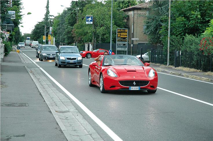 You can always spot a bright red patch on the streets of Maranello.